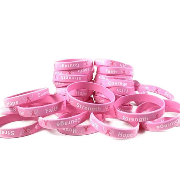 A pile of Breast Cancer Awareness Bracelets.