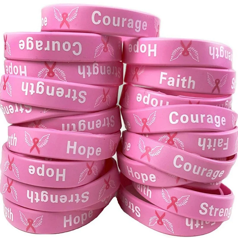 A stack of Breast Cancer Awareness Bracelets with the words hope and faith.