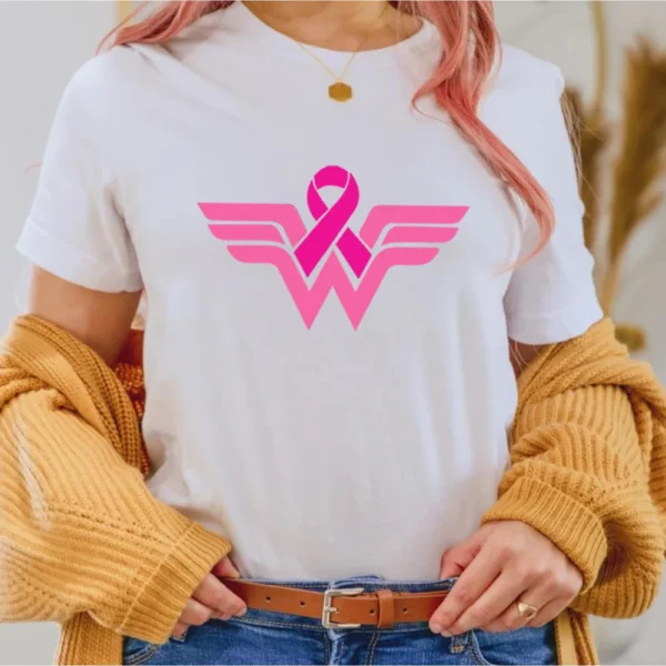 A woman wearing a pink superhero t-shirt.