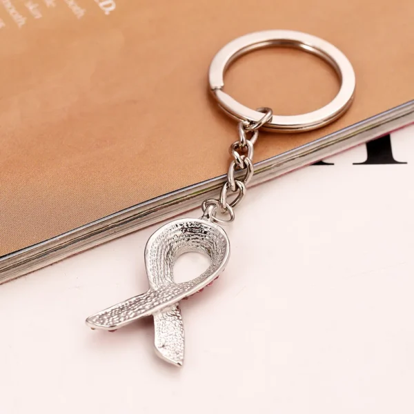 A Crystal Rhinestone Key Chain with a silver ribbon on it.