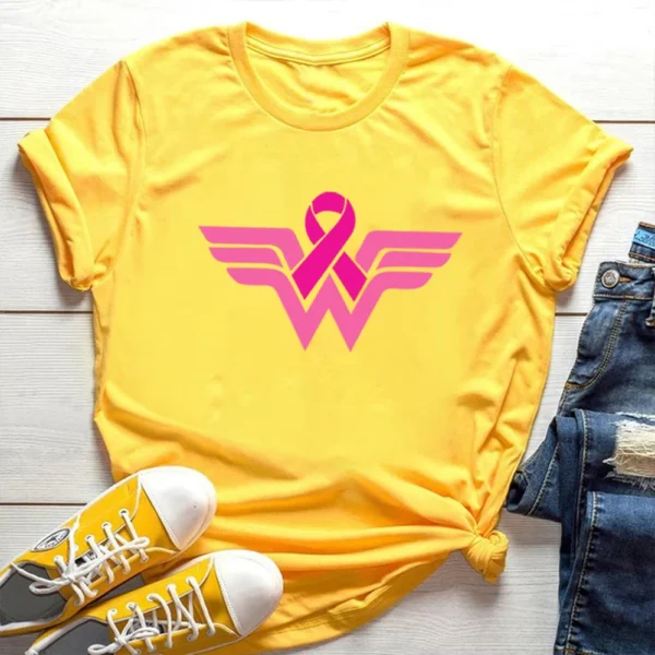 A yellow Superhero T-shirt with a pink wonder woman logo.