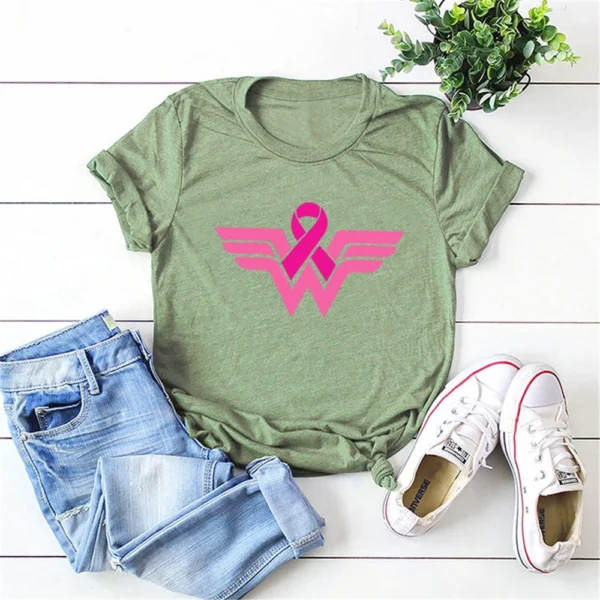 A green Superhero T-shirt with a pink breast cancer ribbon on it.