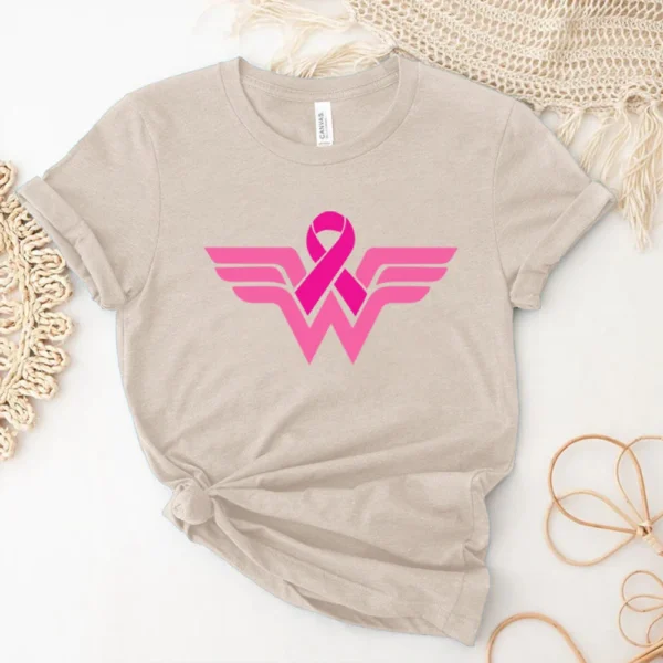 A Superhero T-shirt with a pink ribbon on it.