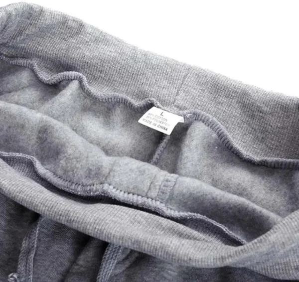 A close up of a pair of men's sweat pants with a label on it.