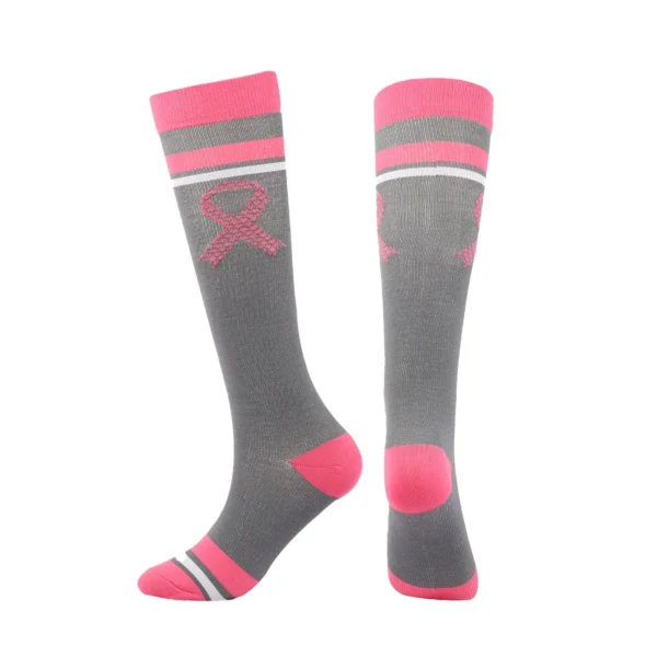 A pair of Unisex Socks with a pink ribbon on them.